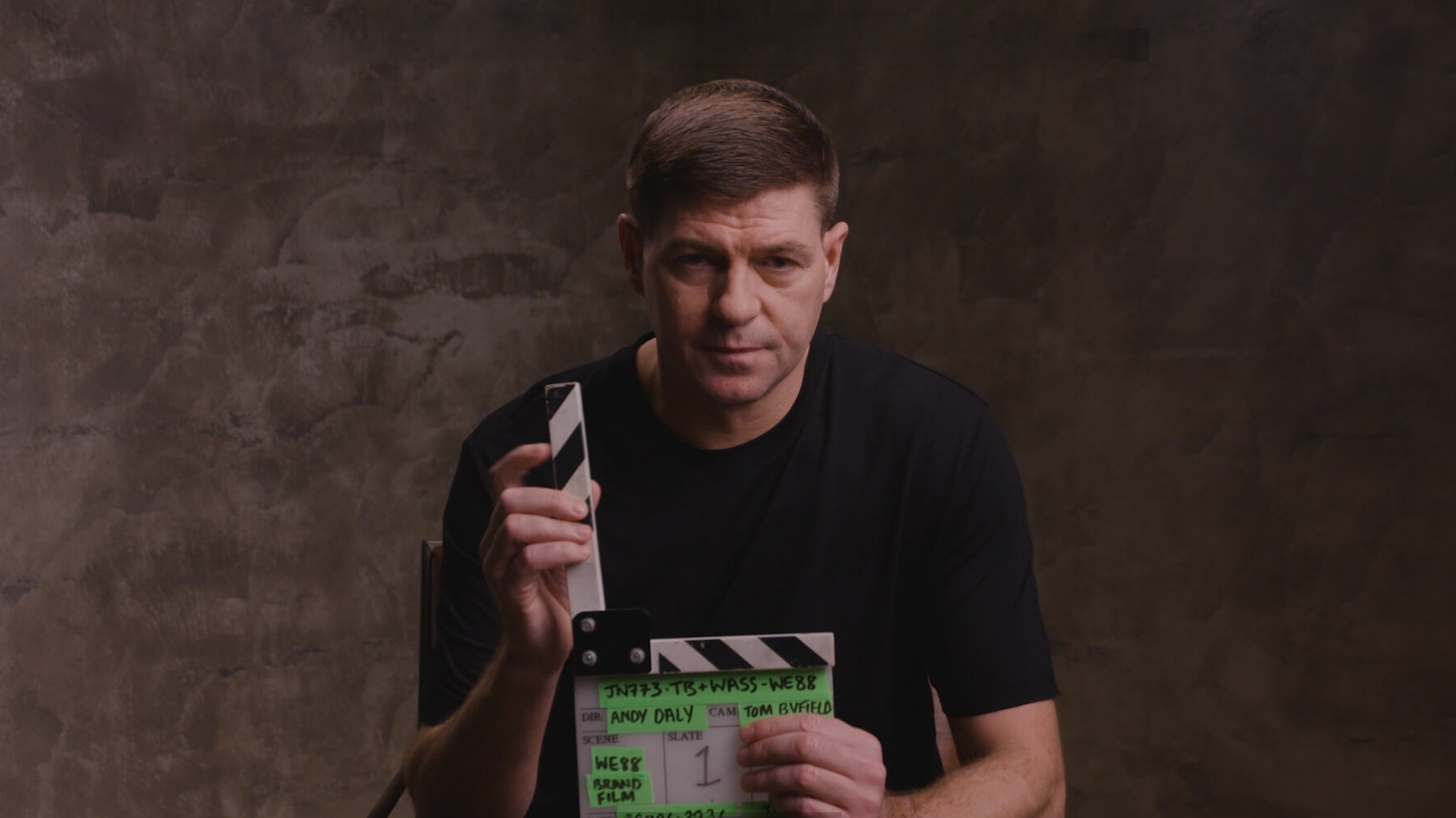 BX99 26/27 Global Brand Ambassador Usain Bolt holding a production clapperboard on set for the official brand film